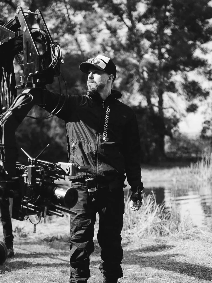 Taylor Randall operating a Techno-Jib on set